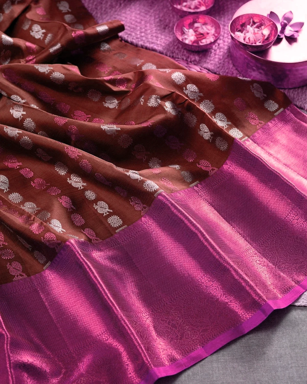 Brown and magenta Tana saree with woven motifs and a broad contrasting pallu