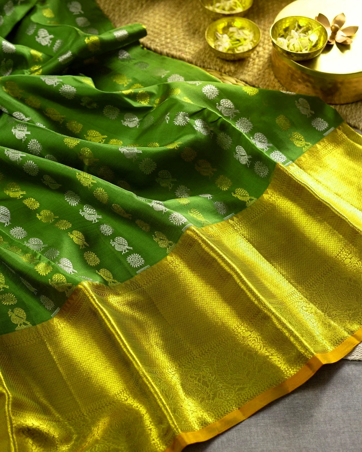 Festive silk saree with warm colour, woven motifs and gold border