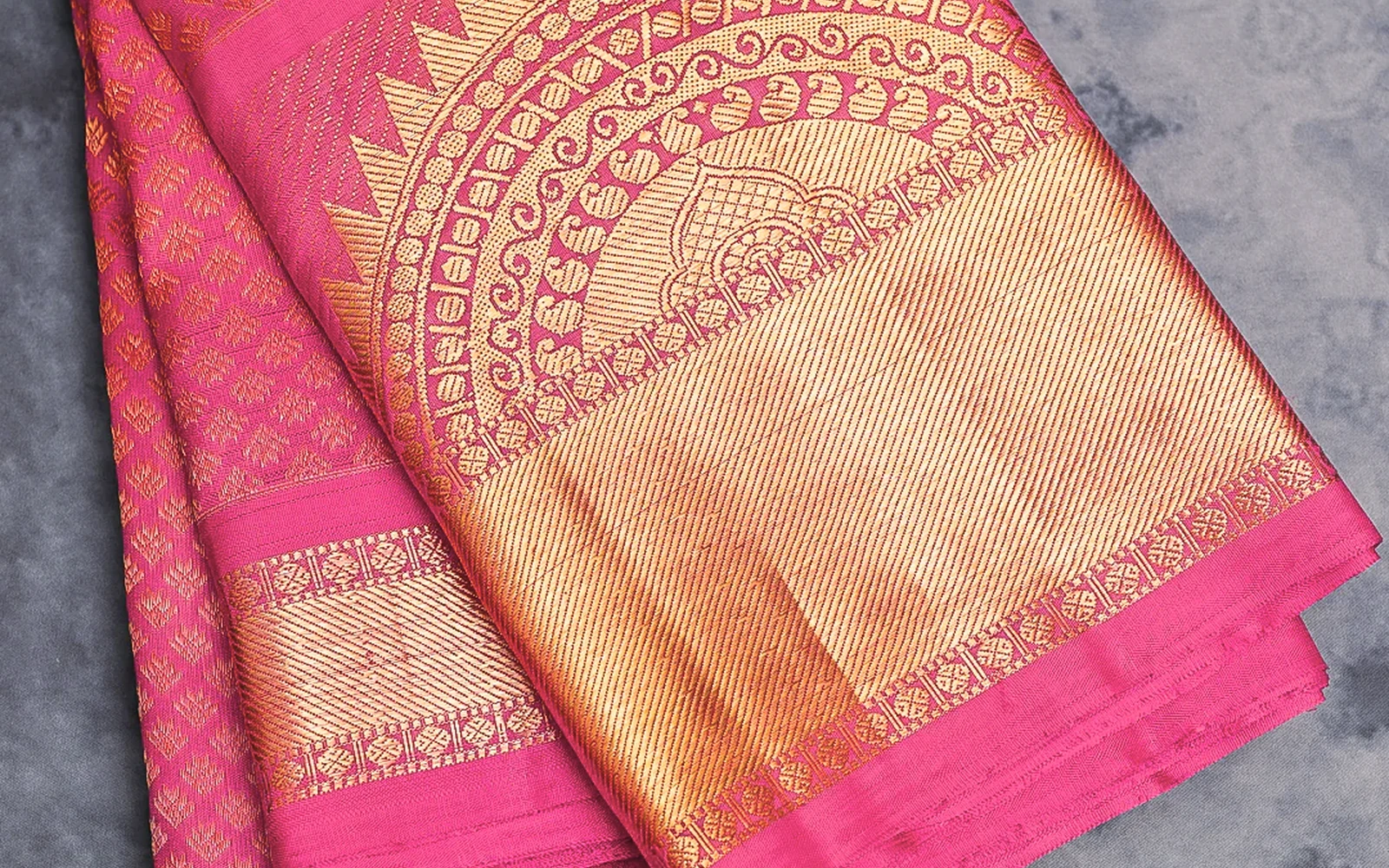 Close view of traditional silk weave and decorative gold border